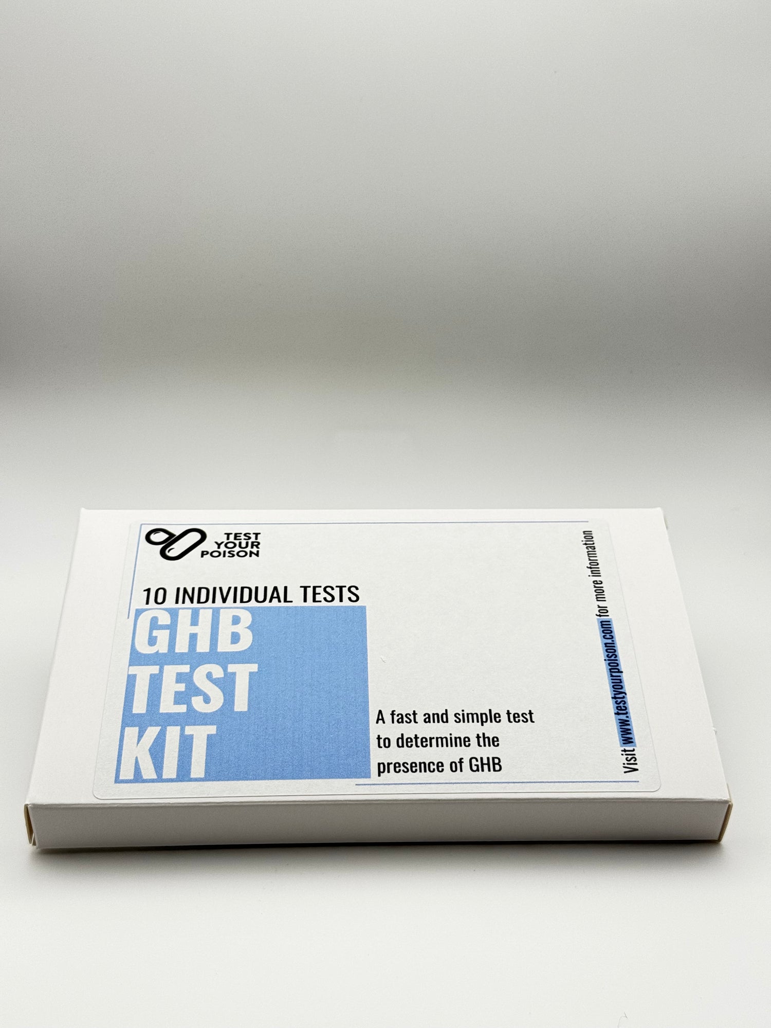 GHB test kit packaging on a gray background