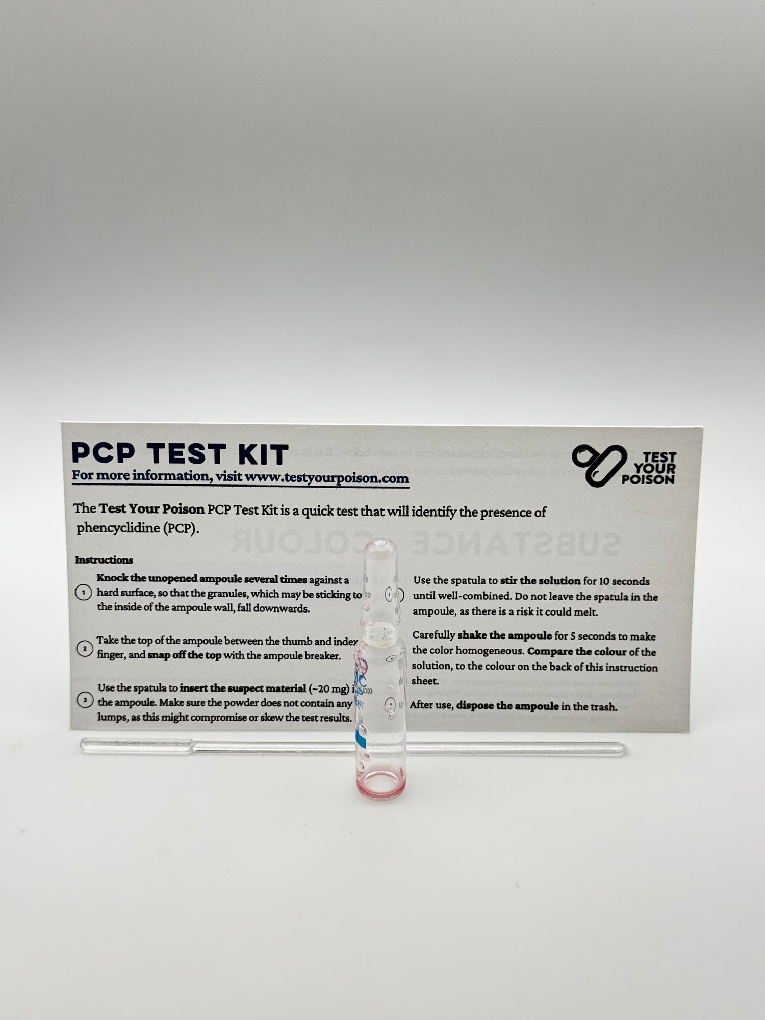 PCP test kit with clear plastic container on a gray background